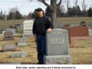 Brad Duke, sexton, Standing next to his great, great grandparents lot