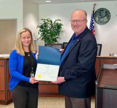 Eaton Finance Director Stephanie Hurd accepts the Auditor of State Award from State Auditor West Regional Liaison Joe Braden.