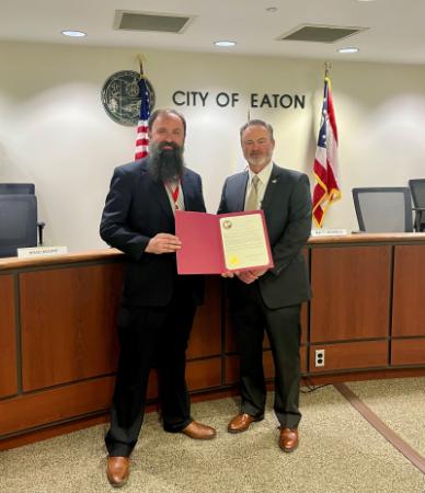 Eaton Mayor Matt Venable (right) joined ARC volunteer Uriah Langmeyer to present a proclamation for Red Cross Month.