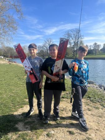 Left to right: Kyler Rathert, Taylan Wilson and Sylas Noble each won a new fishing pole at Kids Fishing Day.